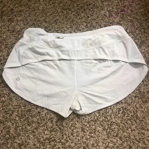 Lululemon white speed-ups size 6 never worn before because I got the wrong size.